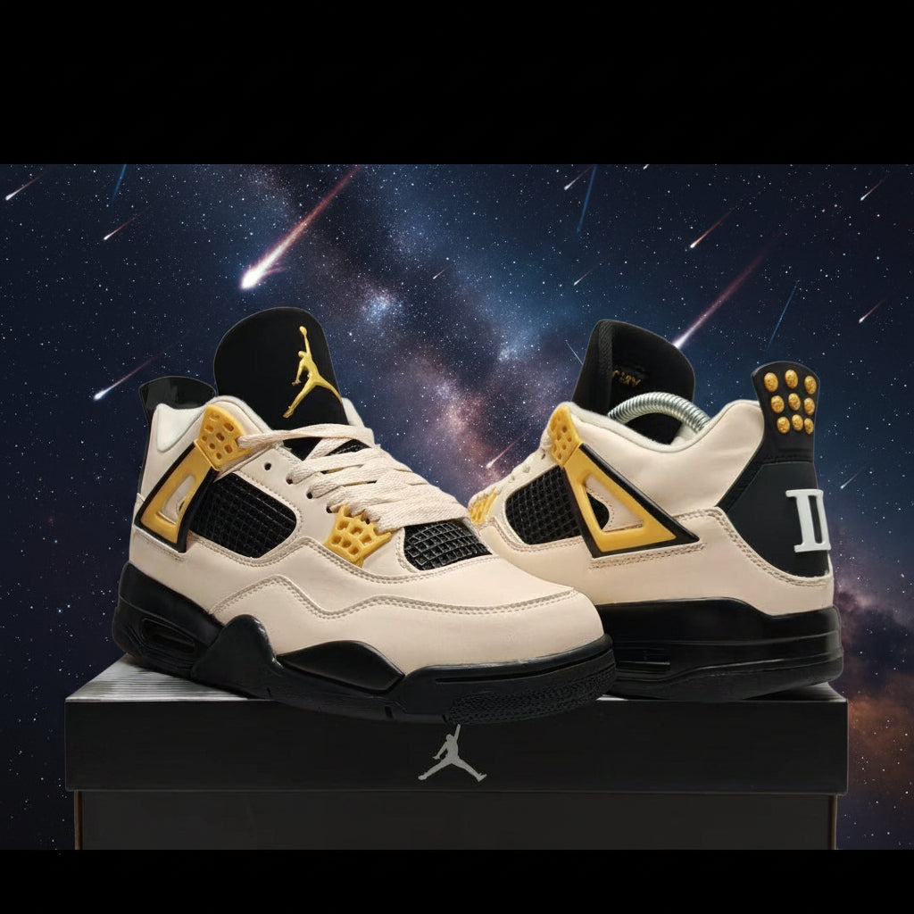 A pair of Air Jordan 4 Retro 'White, Black, and Gold' sneakers displayed on a black shoebox against a textured gray background. The shoes feature a cream/off-white leather upper, black overlays, and gold accents on the tongue, collar, and side panels.