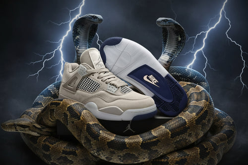 A pair of Nike Air Jordan 4 Retro Low sneakers in beige and navy blue, displayed on a black shoebox against a textured gray background.